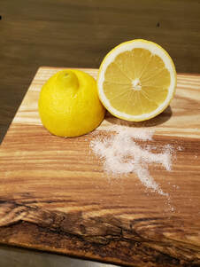 live edge serving board with lemon and salt for cleaning