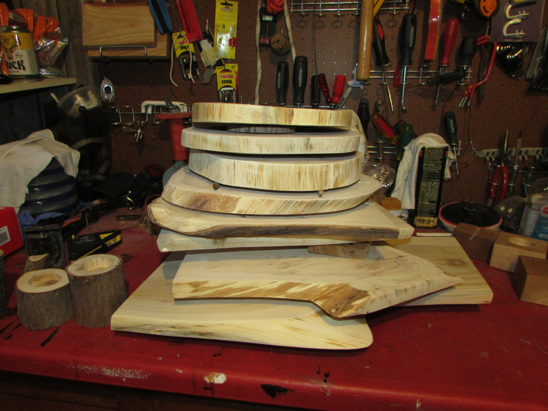 stack of unfinished reclaimed wood charcuterie boards