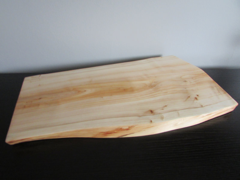 found wood oblong serving board with live edge