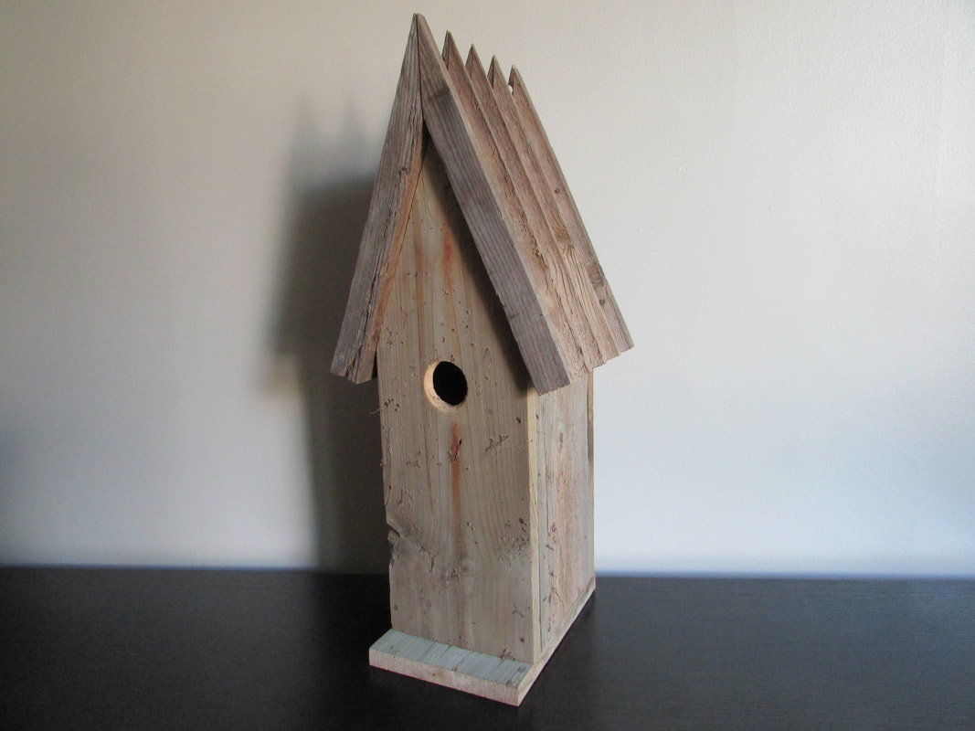 rustic narrow and tall birdhouse